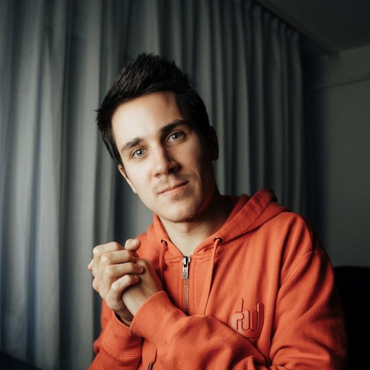 Alex Rivera, Lead Design Curator at PrimeGardenBox, reviewing corporate floral arrangements